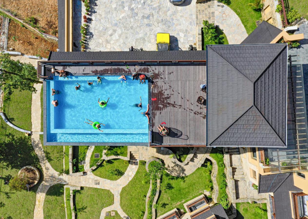 Bar Peepal Resort Pokhara Eksteriør billede Aerial view of the pool