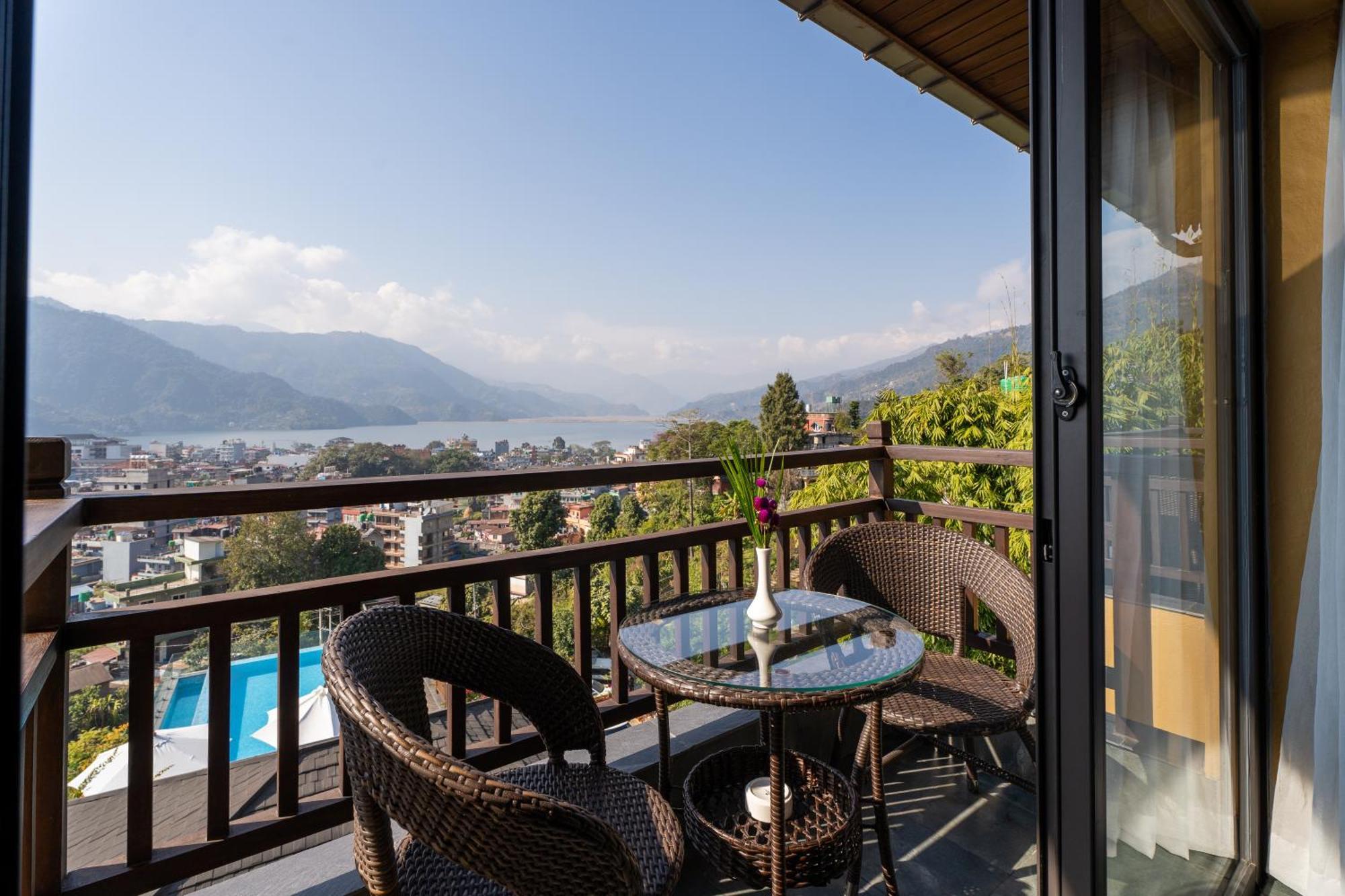 Bar Peepal Resort Pokhara Eksteriør billede A view of Lake Biwa from a guest room